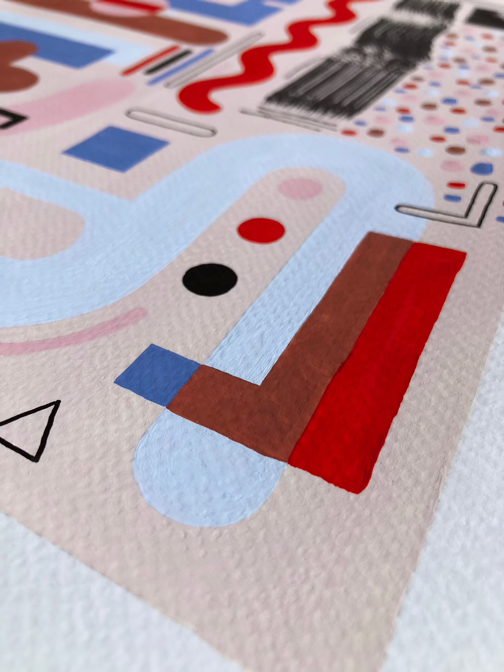 Close up of a corner of unframed abstract artwork with gouache and fine liner