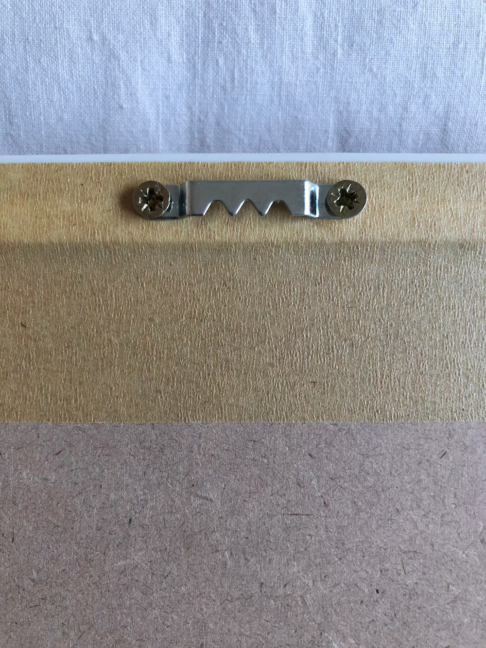 The back of the frame for hanging up on the wall