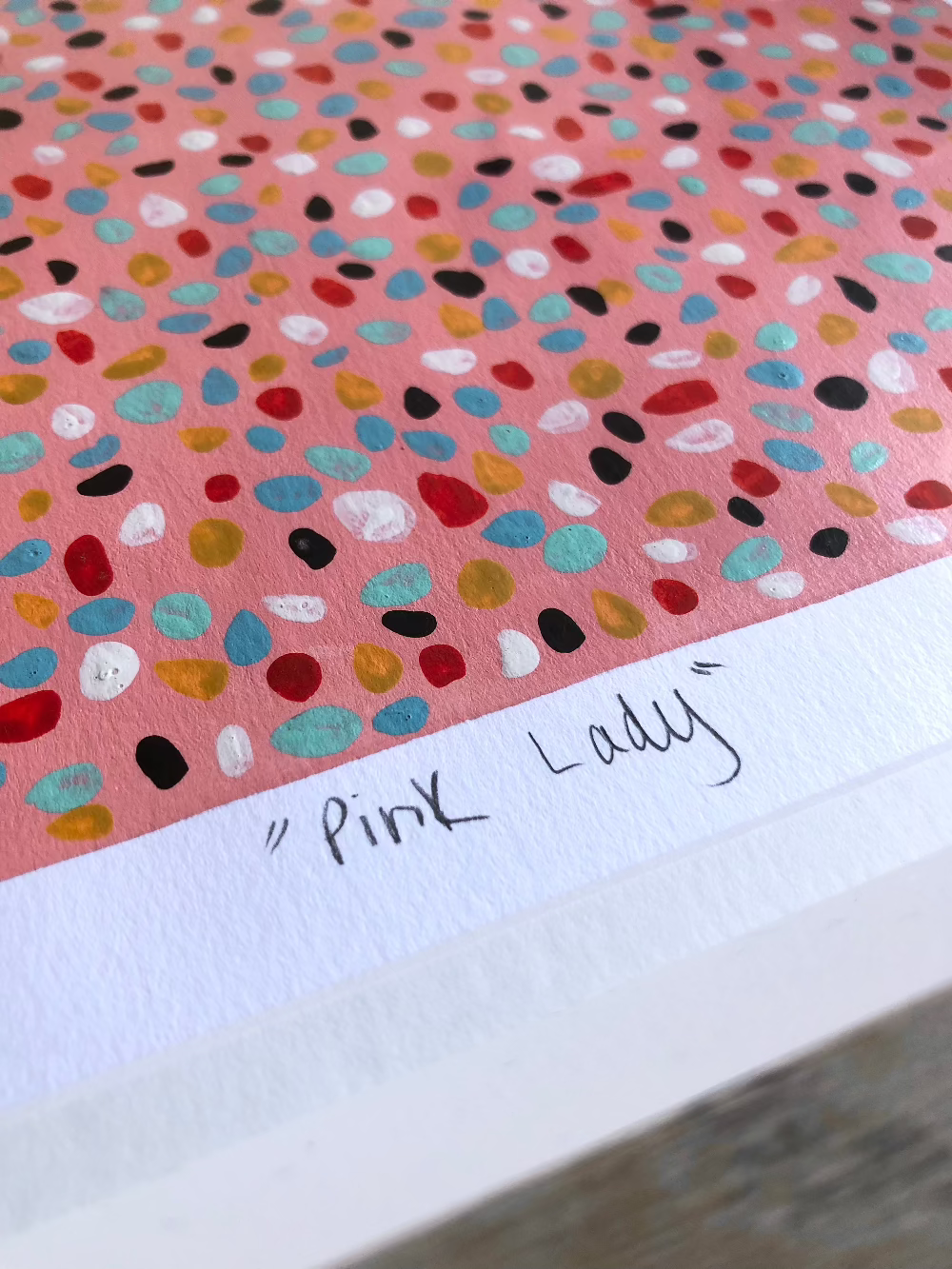 Close up of Pink Lady abstract artwork title.