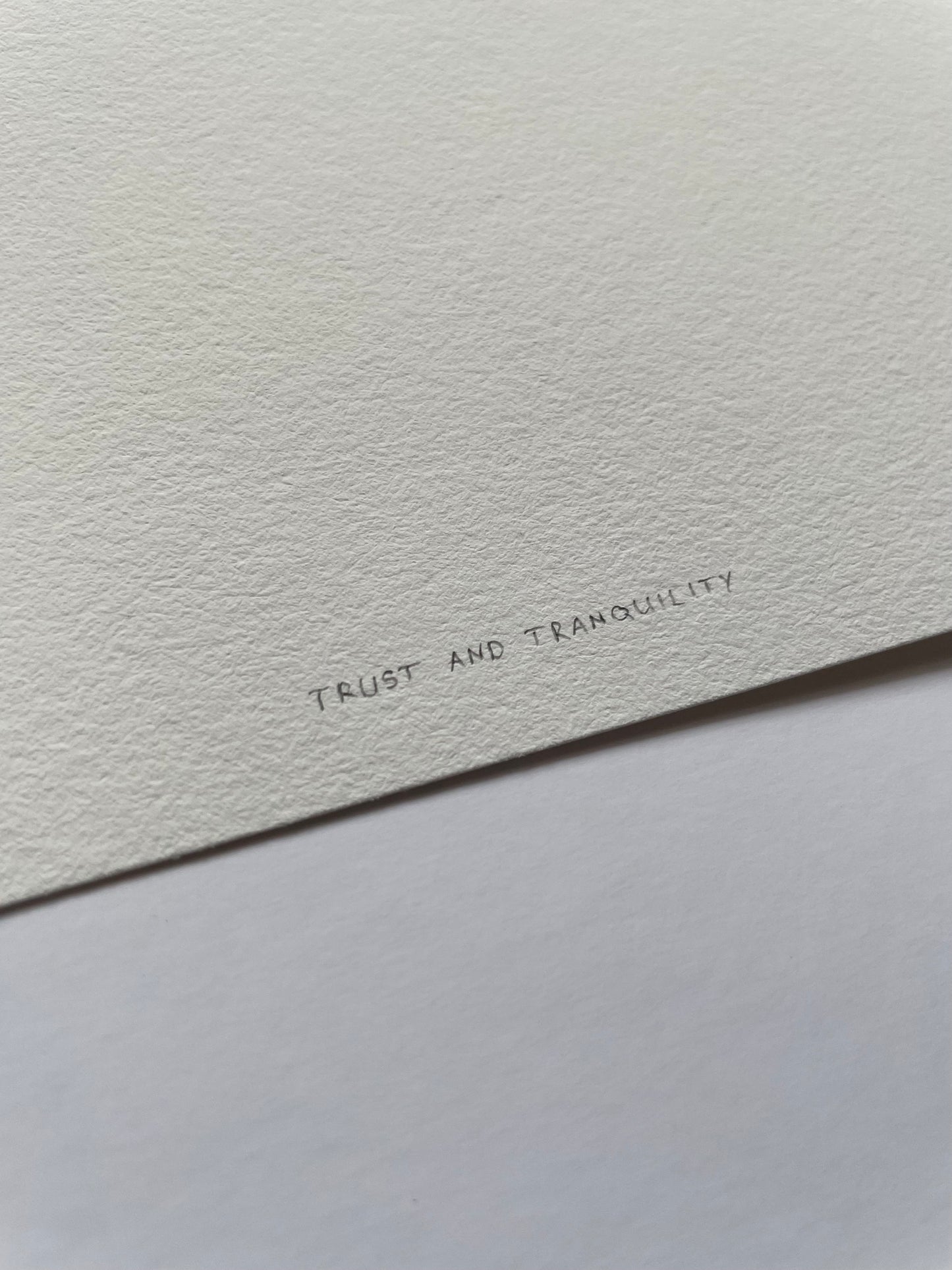 Light textured paper with 'Trust and Tranquility' written on it