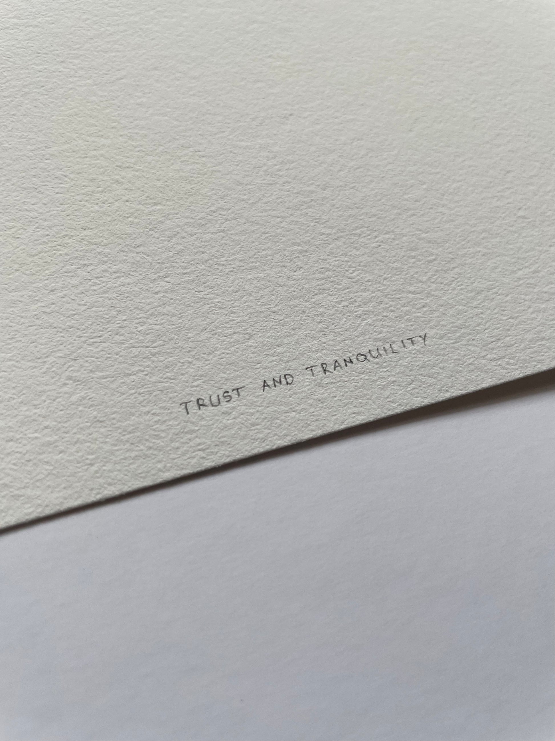 Light textured paper with 'Trust and Tranquility' written on it