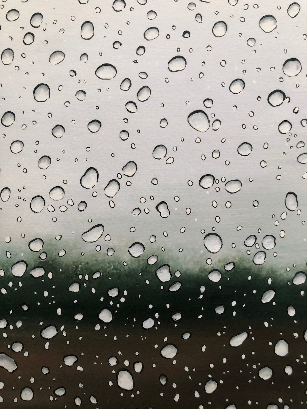 Raindrops on a window with a blurred outdoor background