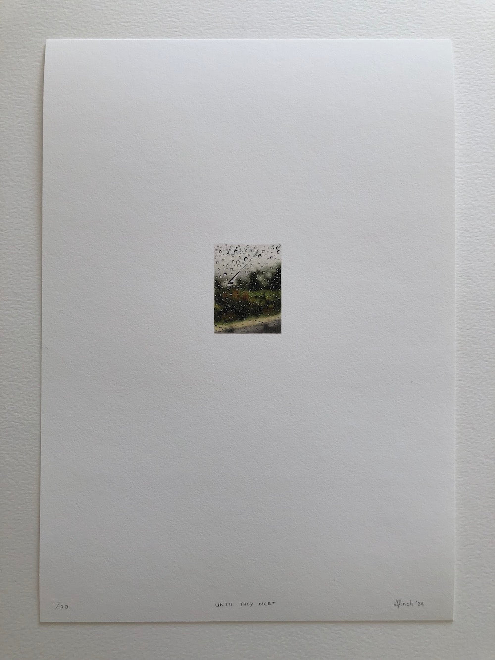 A tiny print on an A4 white sheet of paper with artists signature